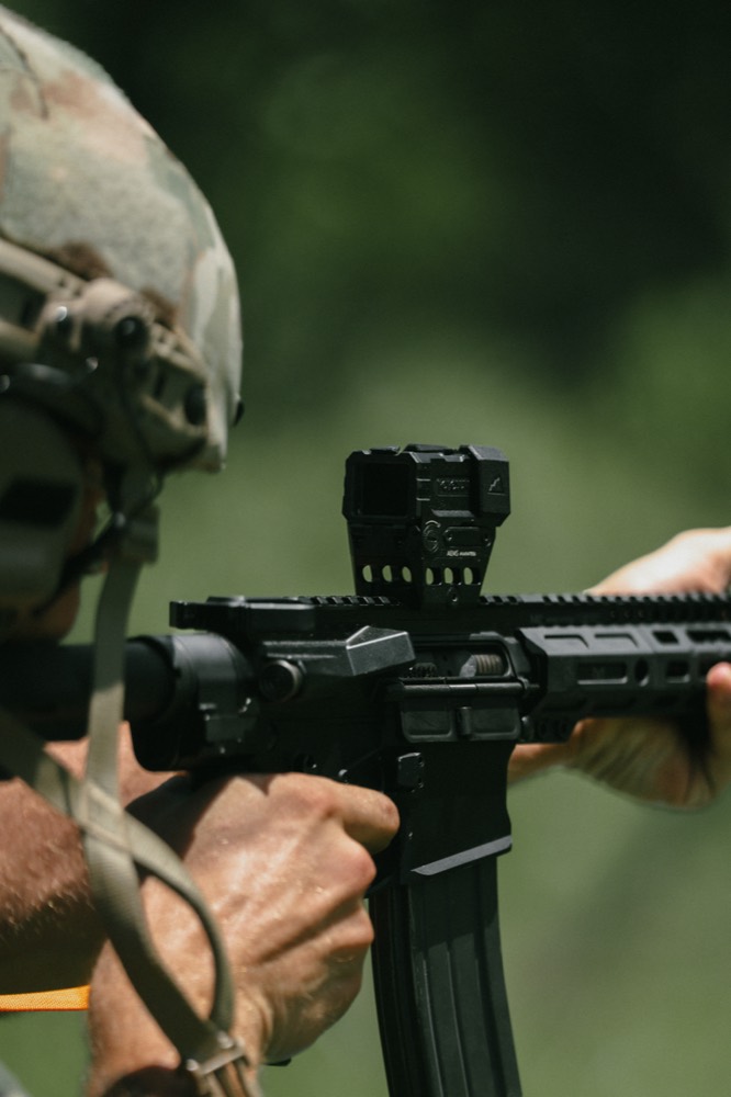 Red dot optic mounted on an AR-15 upper receiver