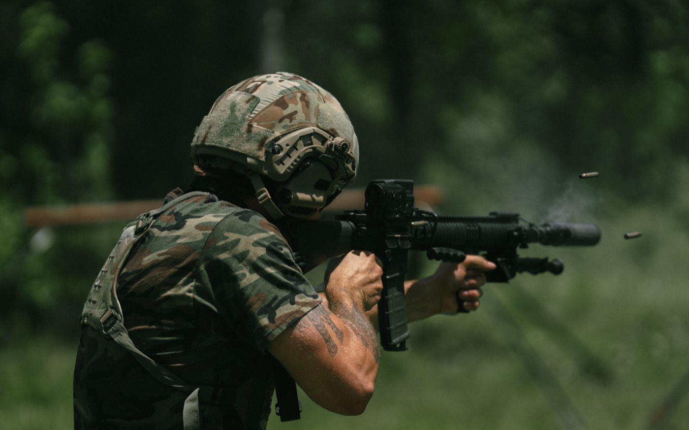 AR-15 fired with brass and smoke in the air