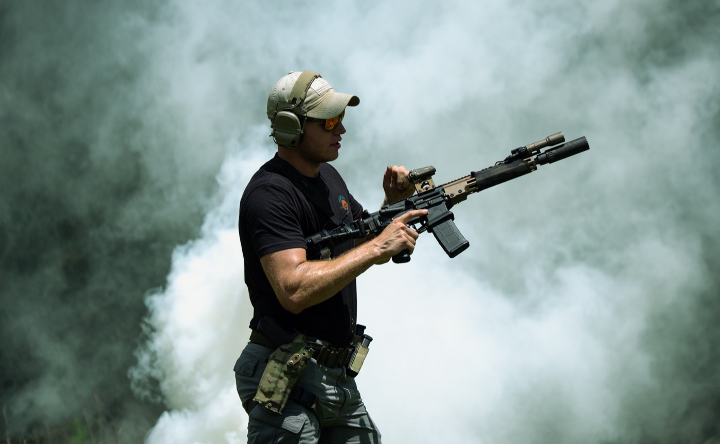 Shooter firing into heavy smoke on the range