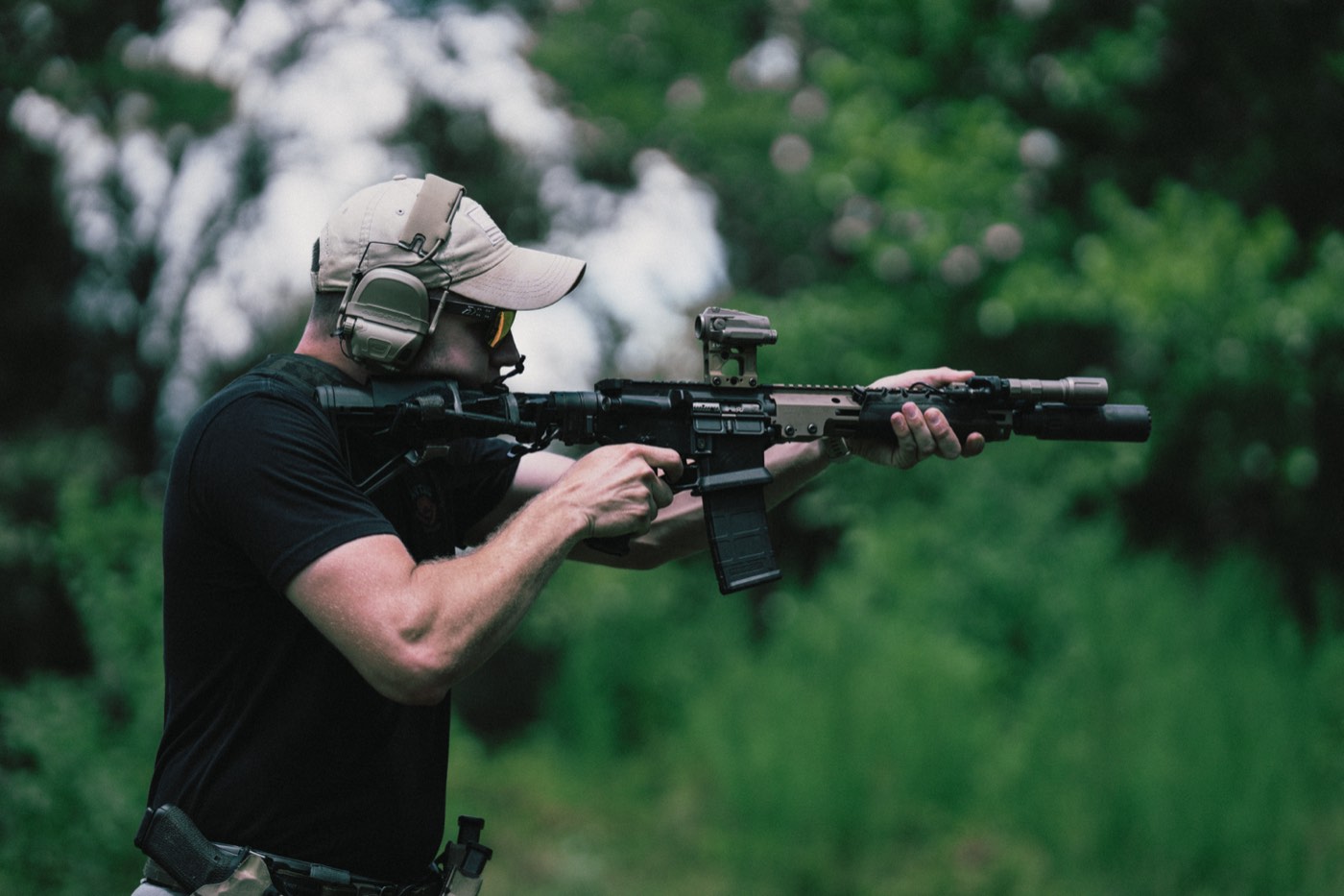 Shooter firing an AR-15 from a standing position