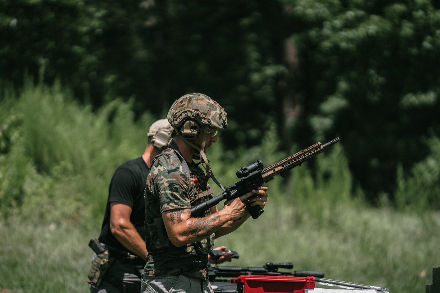 Shooter reloading a suppressed AR-15