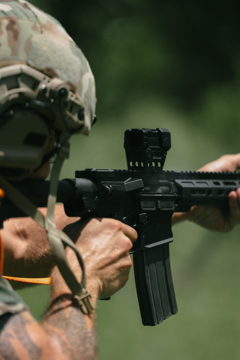 Close-up of an optic and magazine on an AR-15