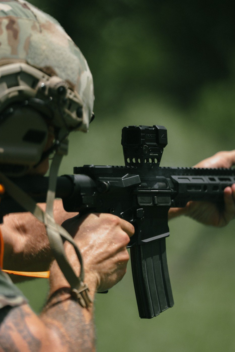 Close-up of an optic and magazine on an AR-15